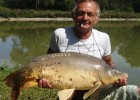 le papa d'un bon ami carpiste et une miroir de 13 kgs